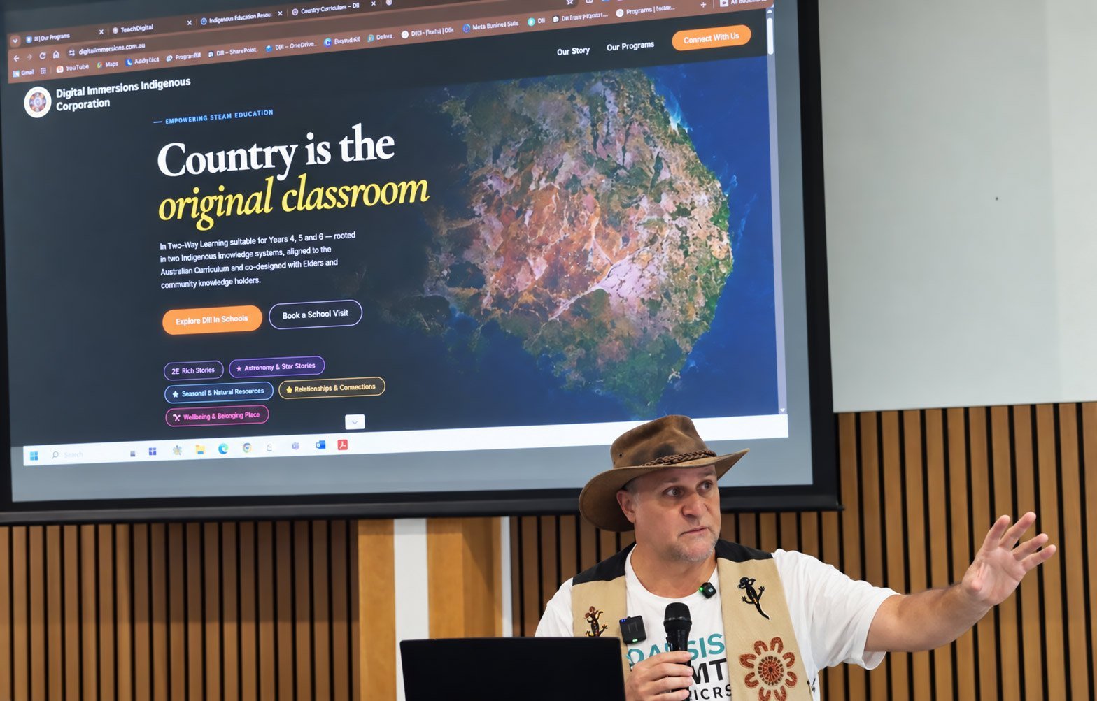 Brett Leavy gestures to the room beneath a projected web page headed Country is the original classroom, a Country-based program for primary schools.
